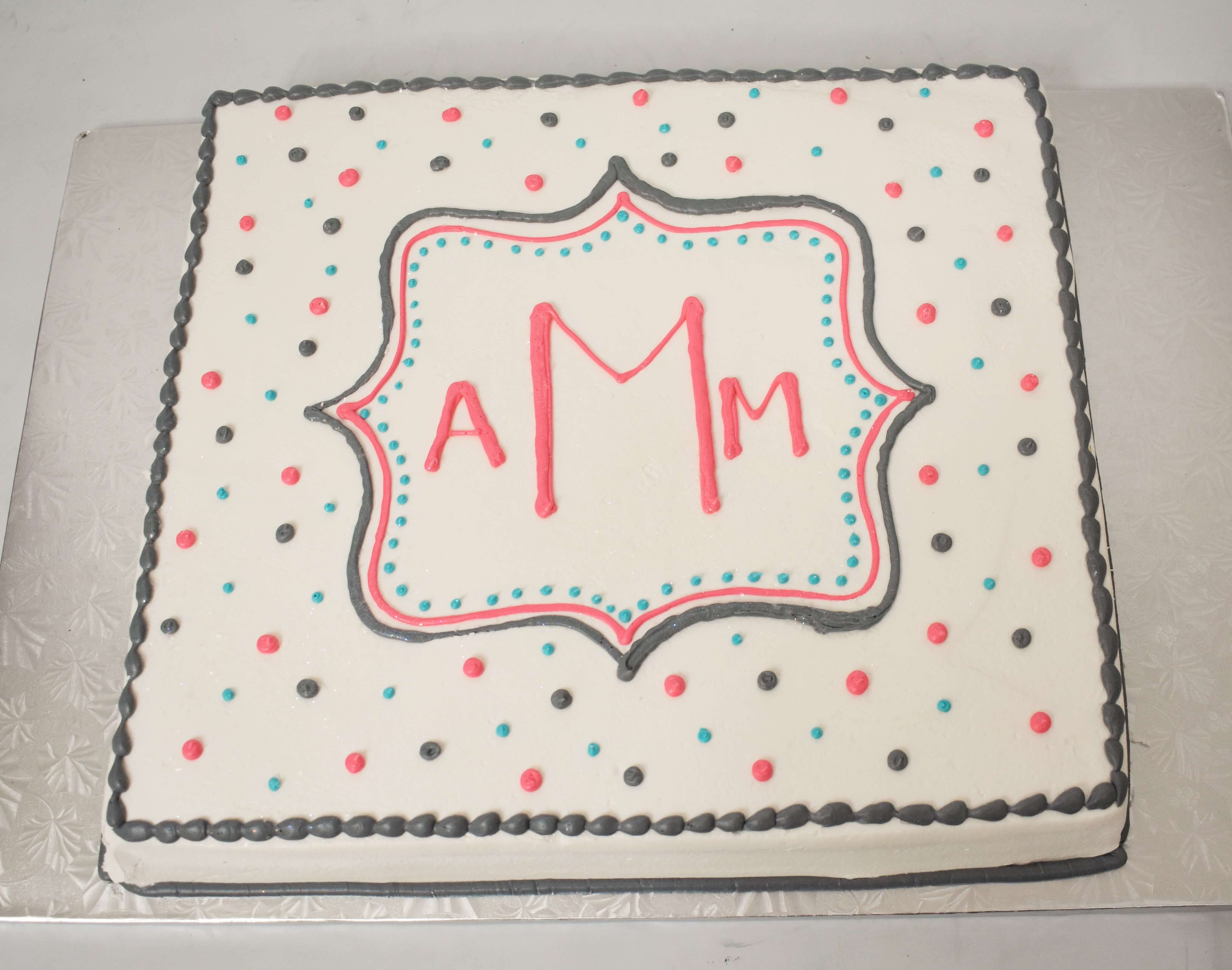 MaArthur's Bakery Custom Cake with Monongram Inside a Plaque and Polka Dots