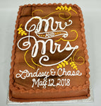 MaArthur's Bakery Custom Cake with Wooden Look Background with Mr. and Mrs. in Fancy Script