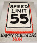 MaArthur's Bakery Custom Cake with the Words Speed Limit 55 Written in Black