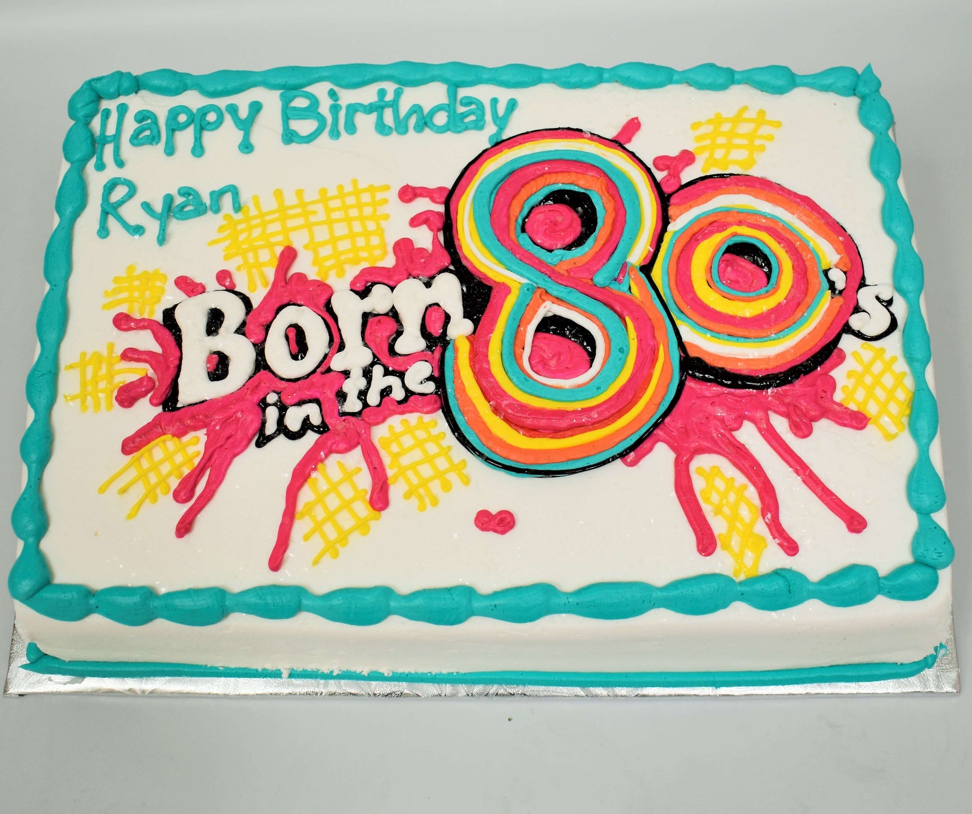 MaArthur's Bakery Custom Cake With Born in the 80"s Paint Splatter