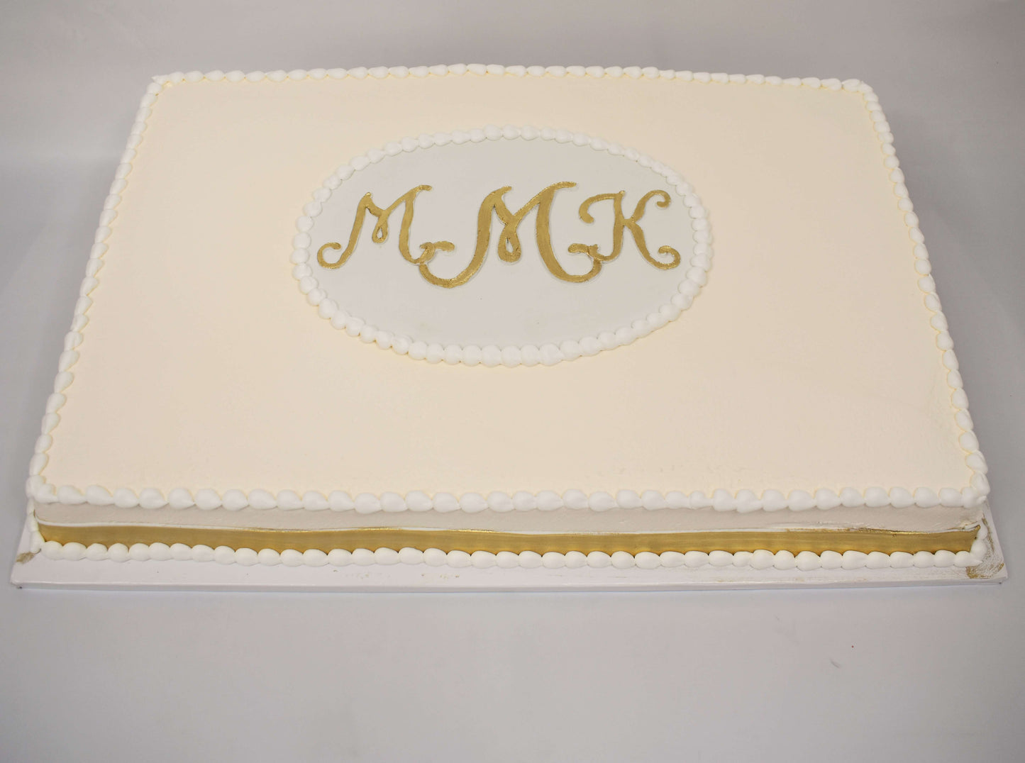 MaArthur's Bakery Custom Cake With Ivory Icing and Gold Monogram, 