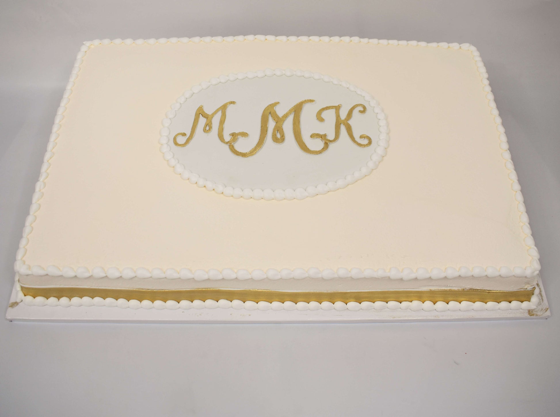 MaArthur's Bakery Custom Cake With Ivory Icing and Gold Monogram, 