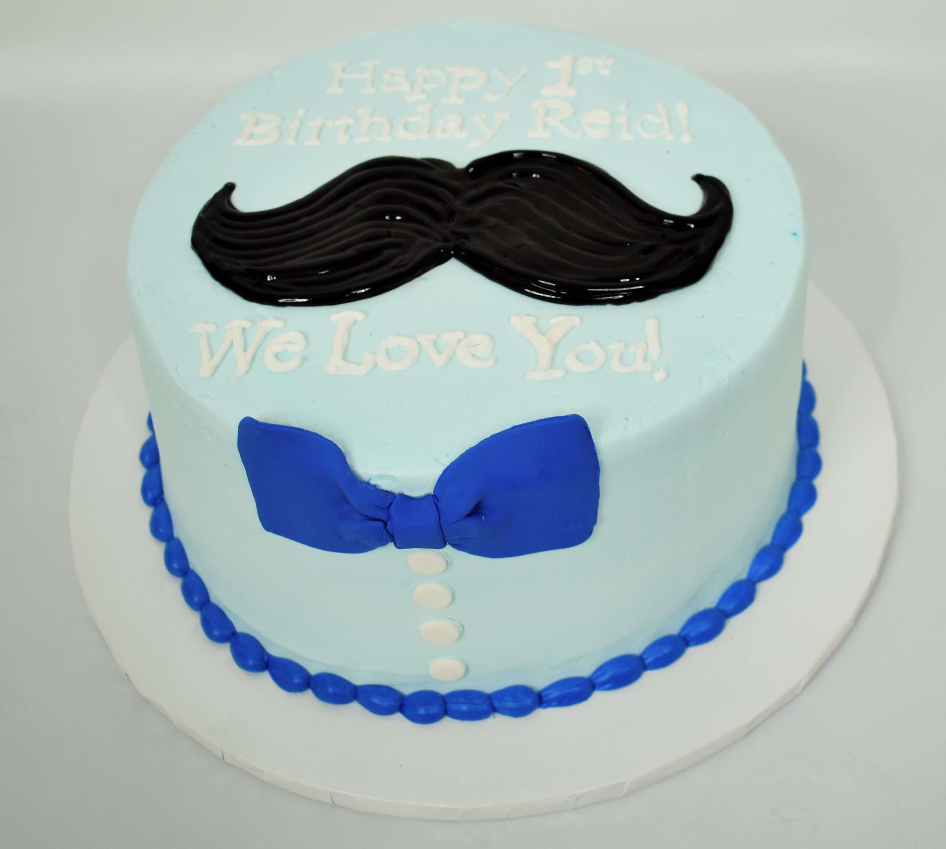 McArthur's Bakery Custom Cake with Black Mustache and Blue Bowtie