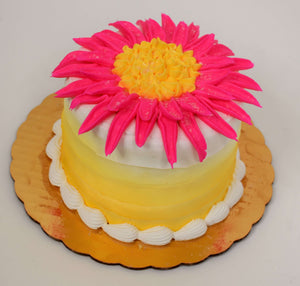 MaArthur's Bakery Custom Cake with a Single Large Pink Flower and Yellow Sides