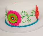 McArthur's Bakery Custom Cake with Large Festive Flowers on Side of Cake