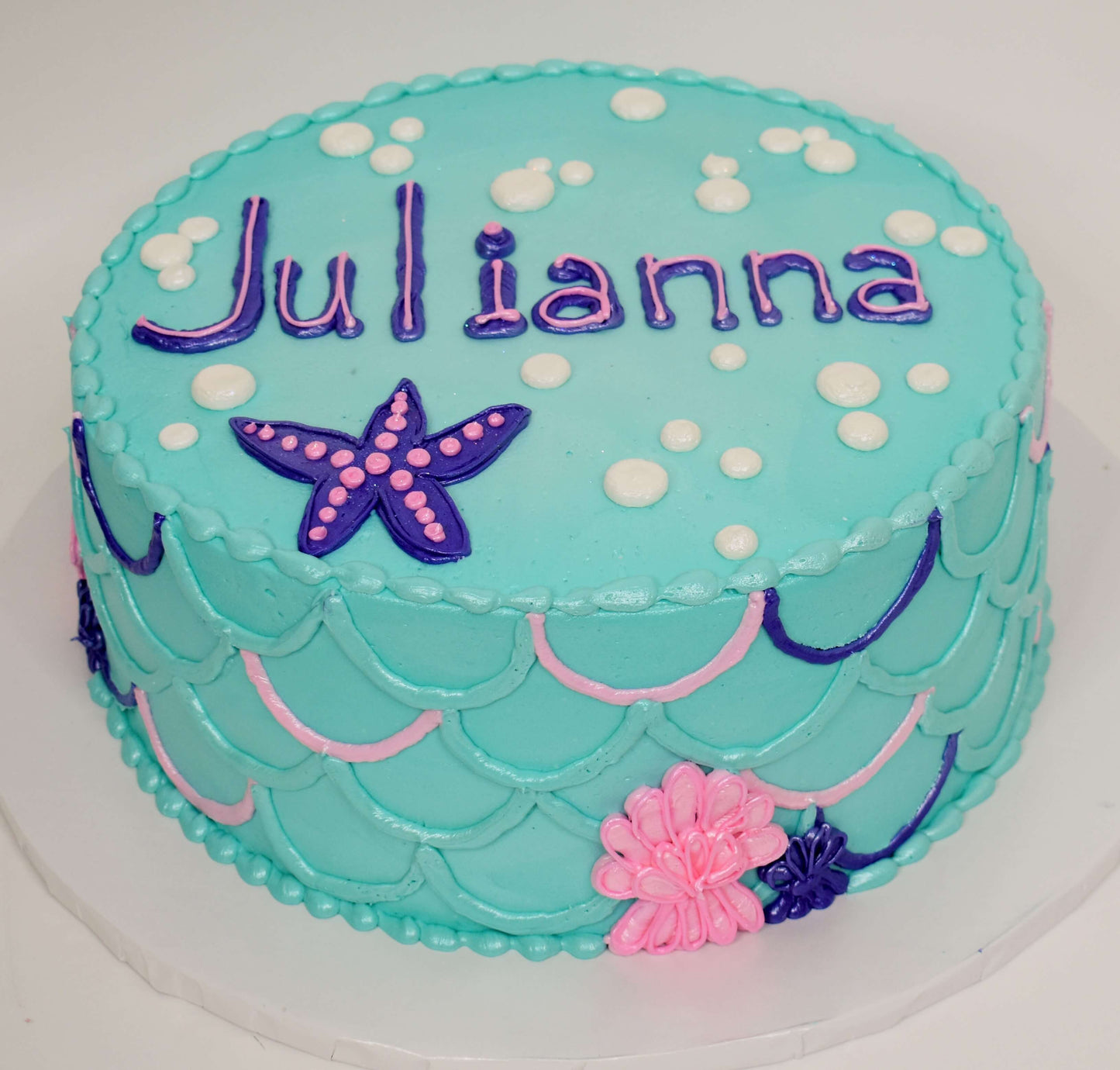 MaArthur's Bakery Custom Cake with Aqua Icing, Mermaid Scales, Starfish and Bubbles