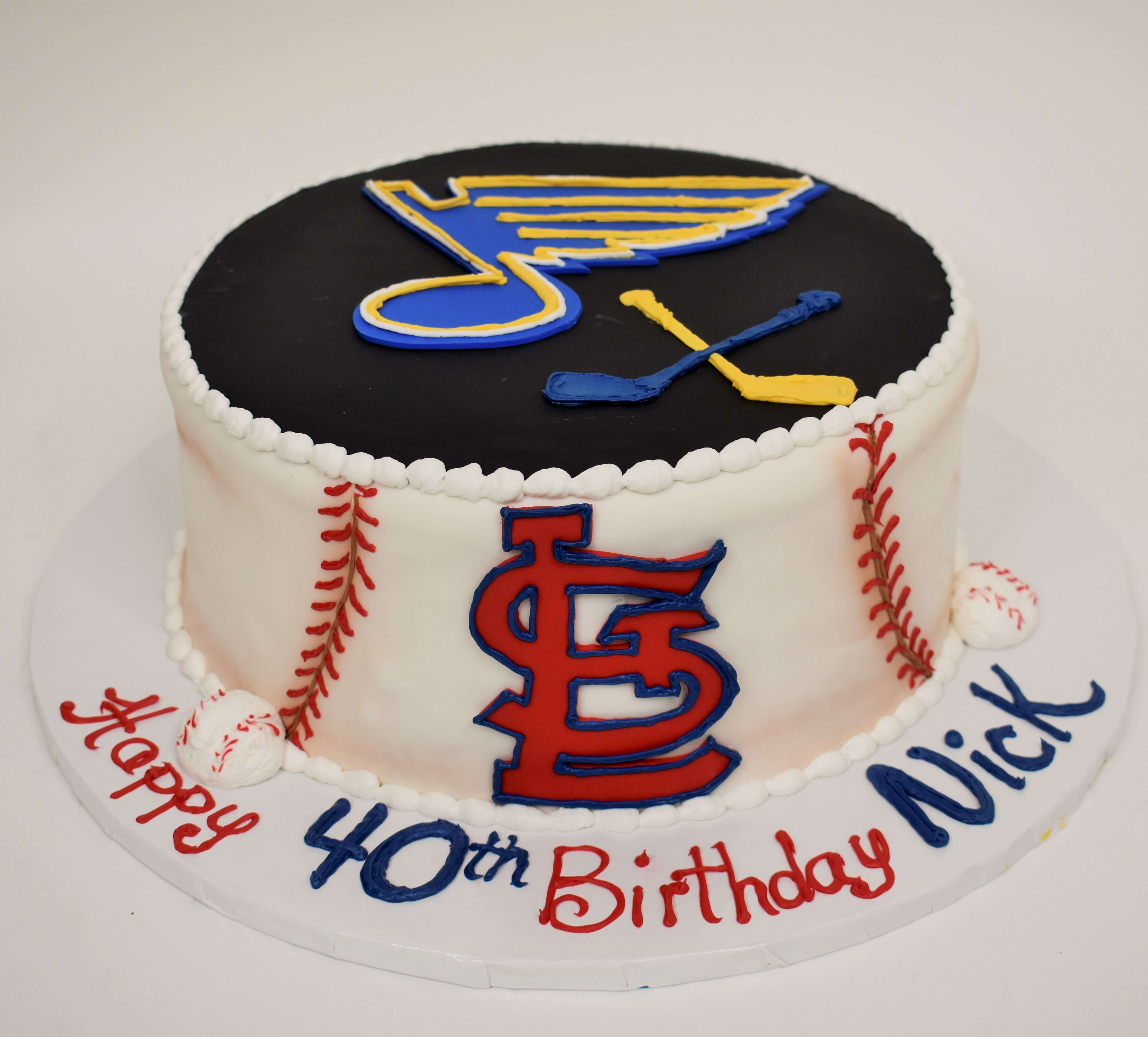 MaArthur's Bakery Custom Cake With Blues Noteand Hockey Sticks on top, Cardinals logo Baselball Stiching on side