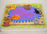 MaArthur's Bakery Custom Cake Sprayed Blue, with Mutiple Cats Laying on a Rug.