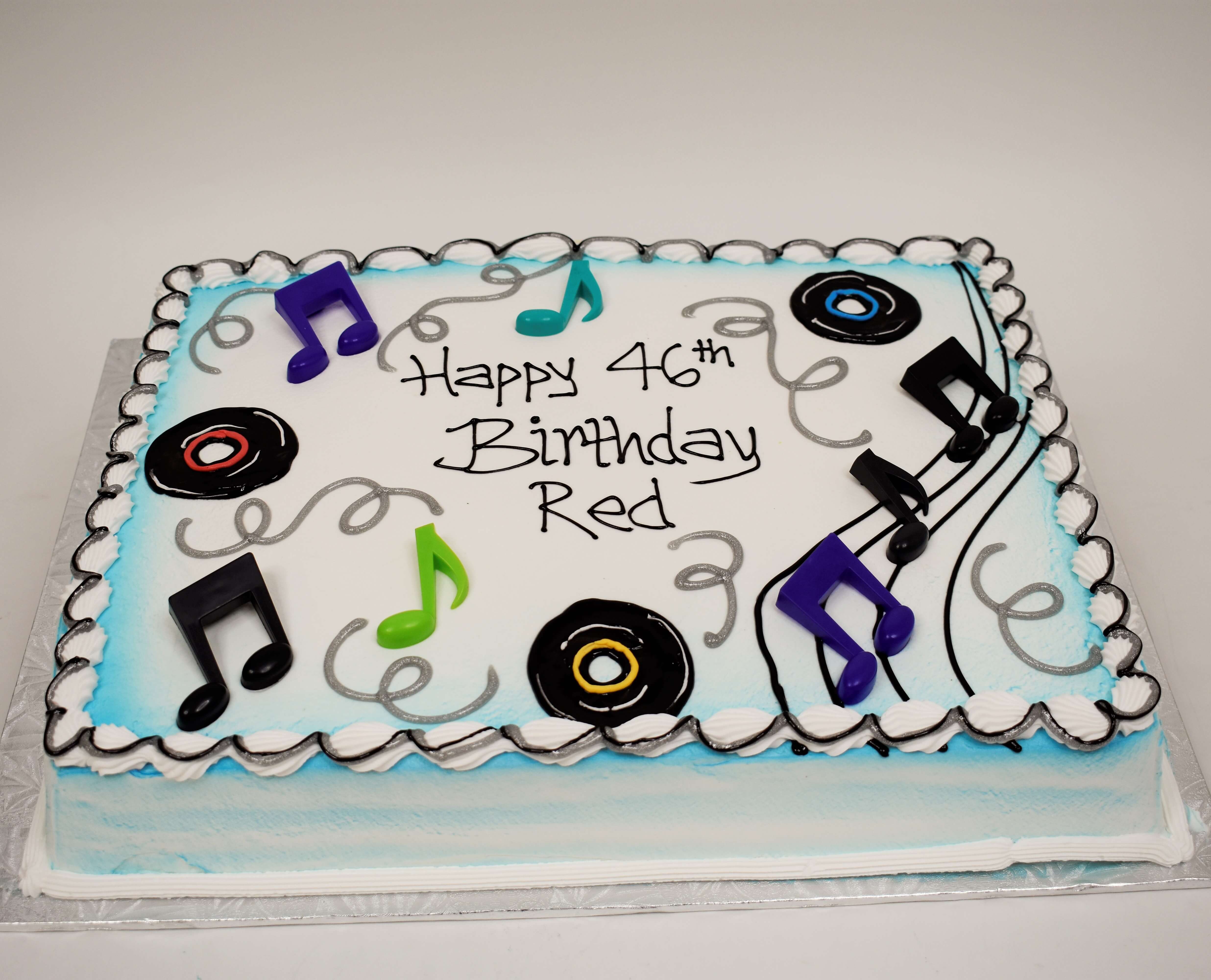 MaArthur's Bakery Custom Cake With Blue Airspray, Musical Notes, Records, Silver Swirls