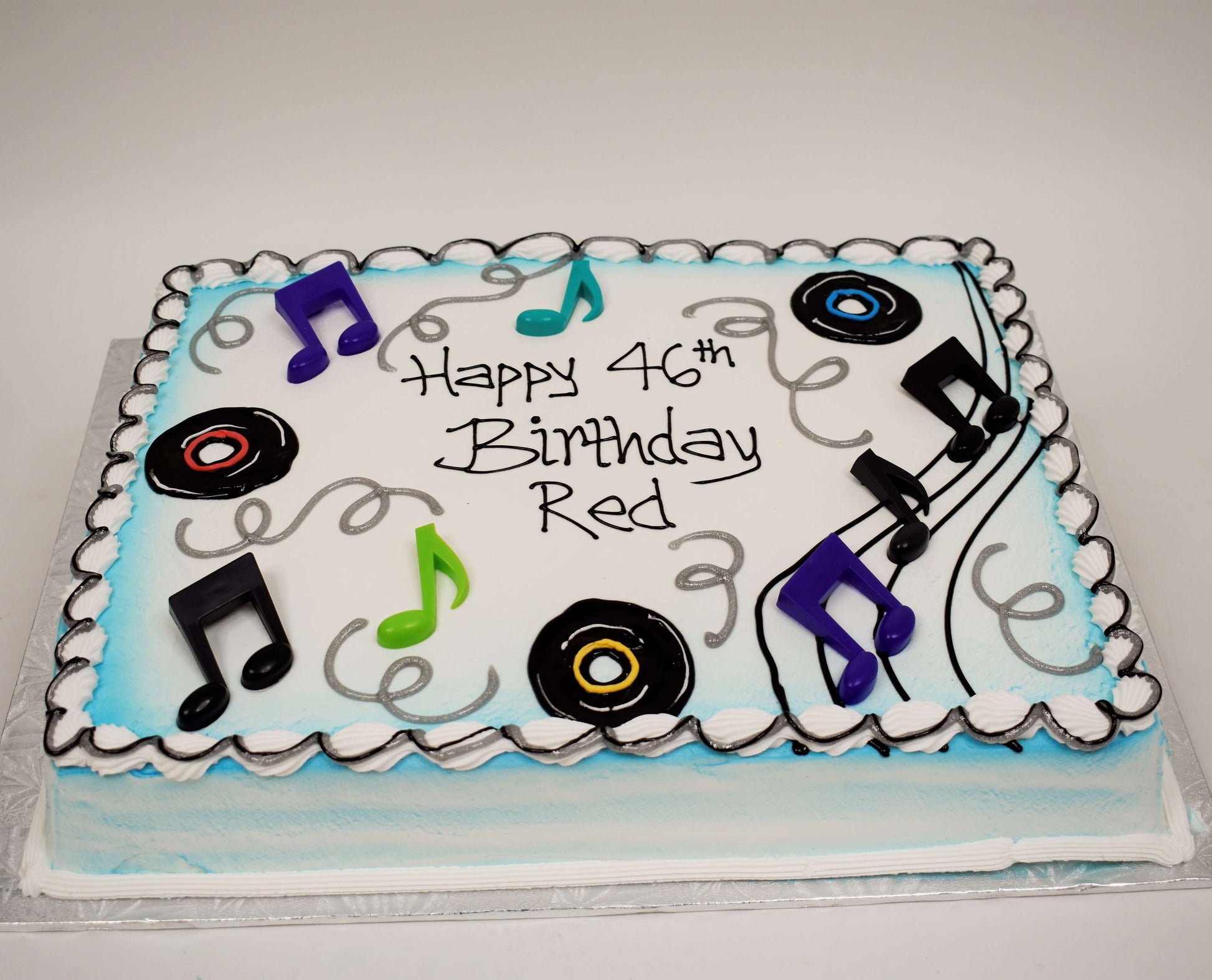 MaArthur's Bakery Custom Cake With Blue Airspray, Musical Notes, Records, Silver Swirls