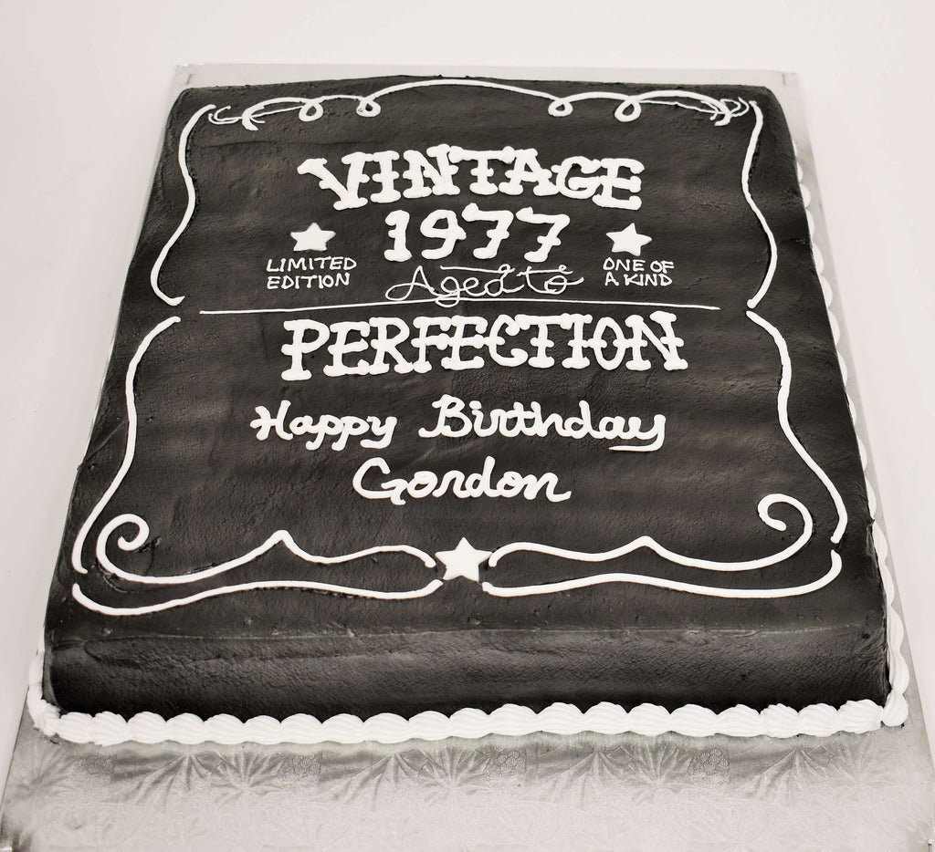 MaArthur's Bakery Custom Cake With Black Icing, White Writing, Aged to Perfection