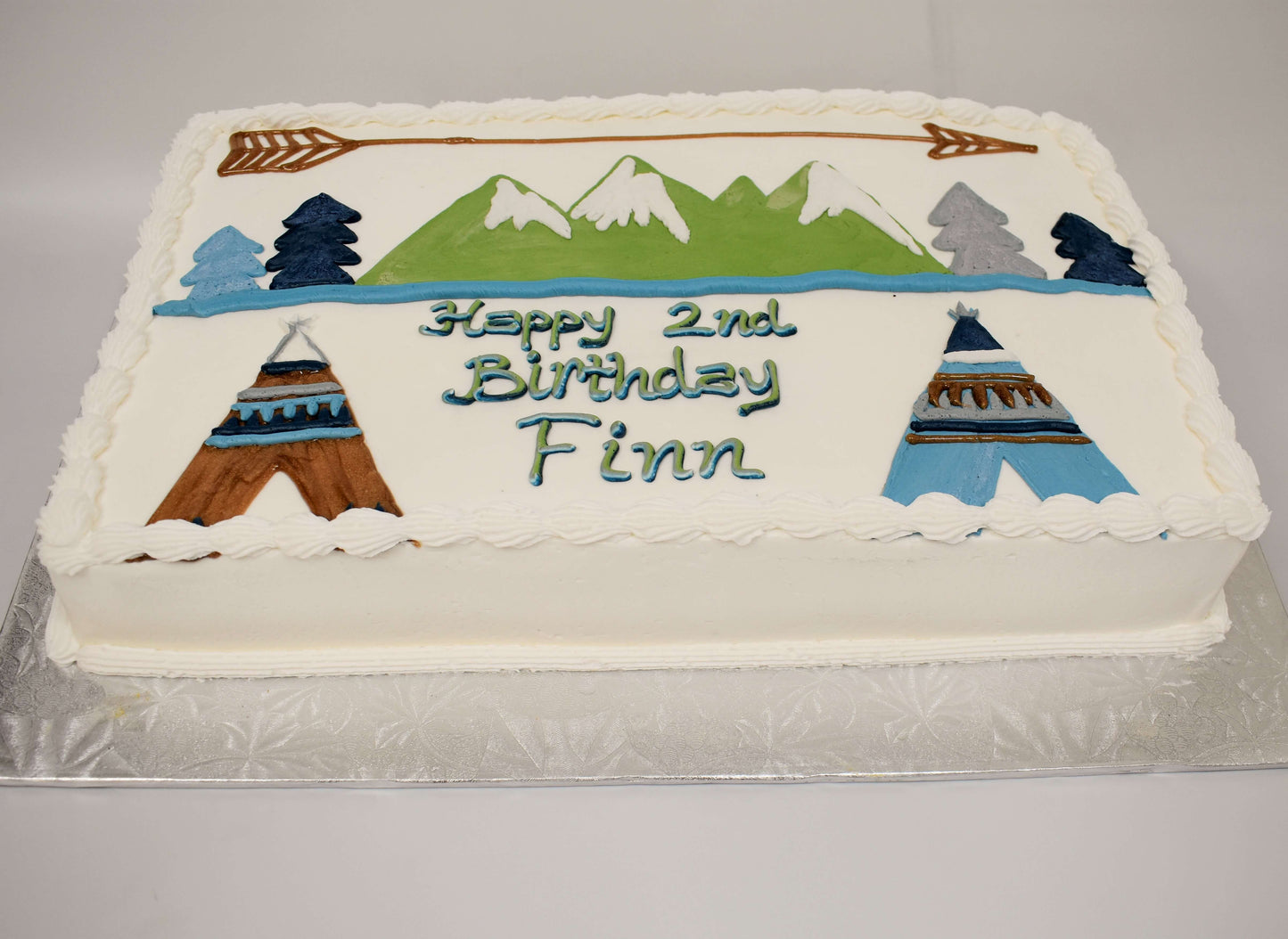 MaArthur's Bakery Custom Cake with Teepee, Arrow, Mountains.