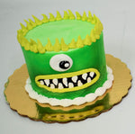 MaArthur's Bakery Custom Cake with Green Monster Face, One eye, Yellow Spikey Hair