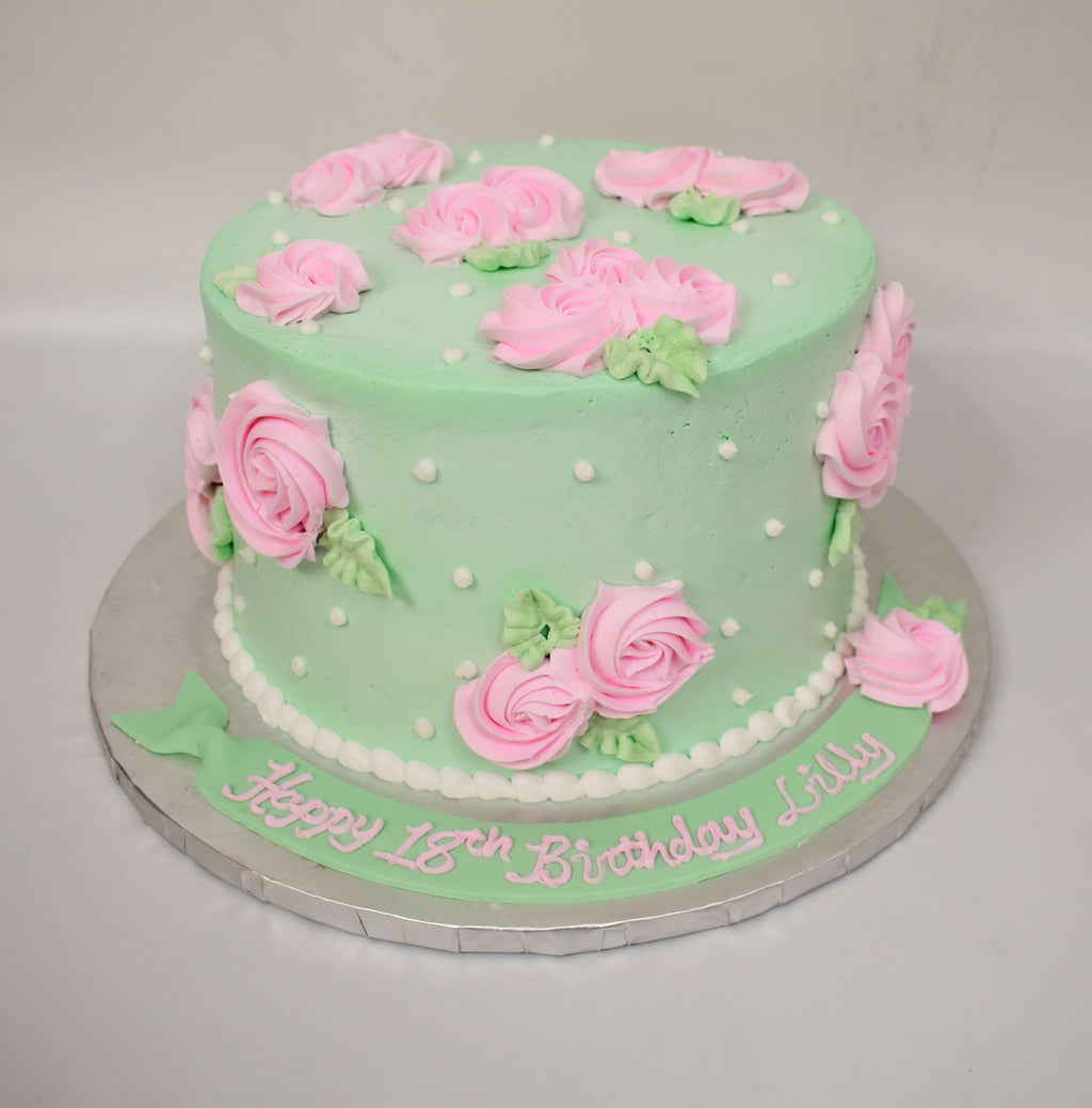 McArthur's Bakery Custom Cake with Pink Rosette, White Polka Dots, Mint Green background