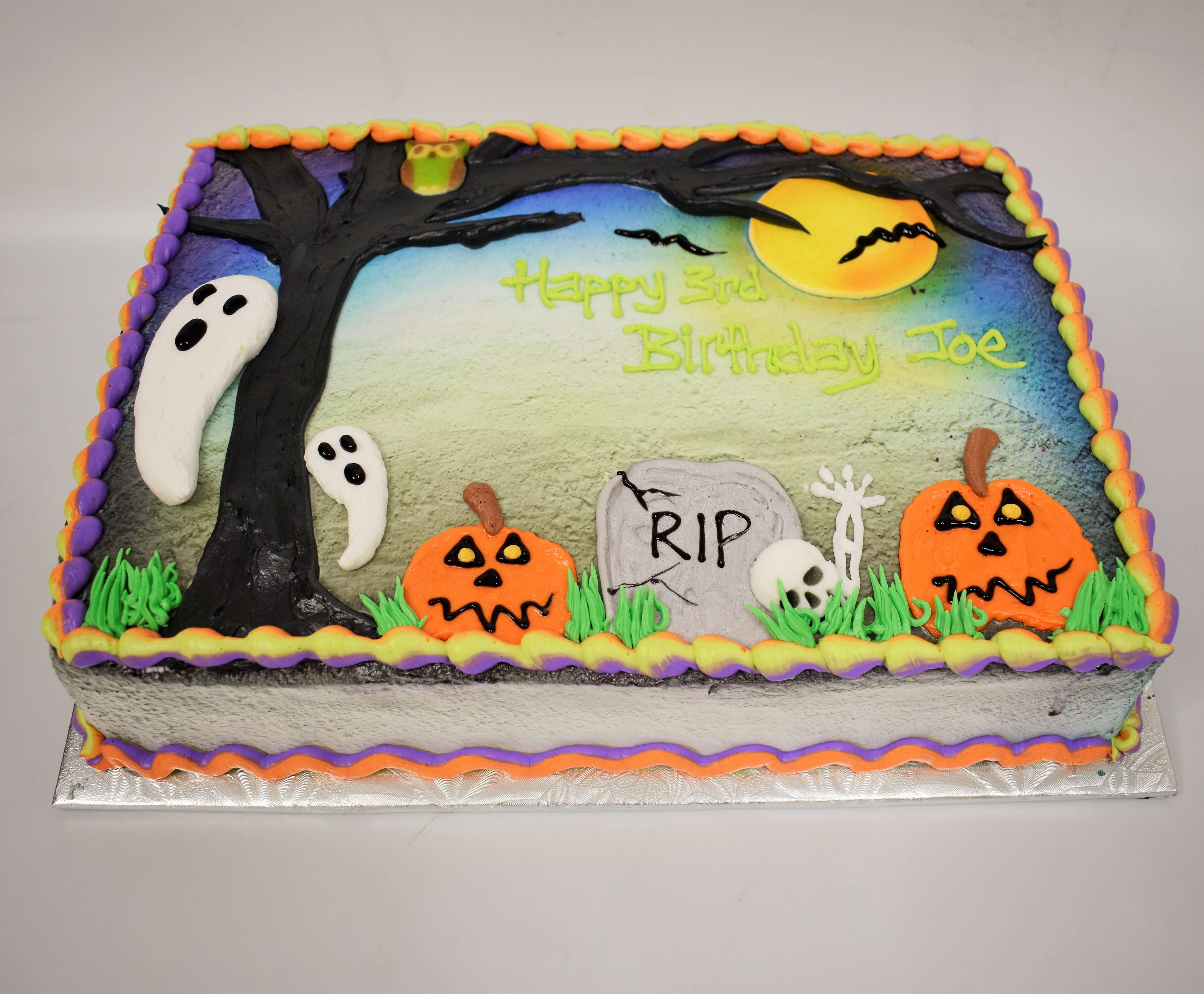 MaArthur's Bakery Custom Cake with Graveyard, ghosts, Pumpkins, Skelton.