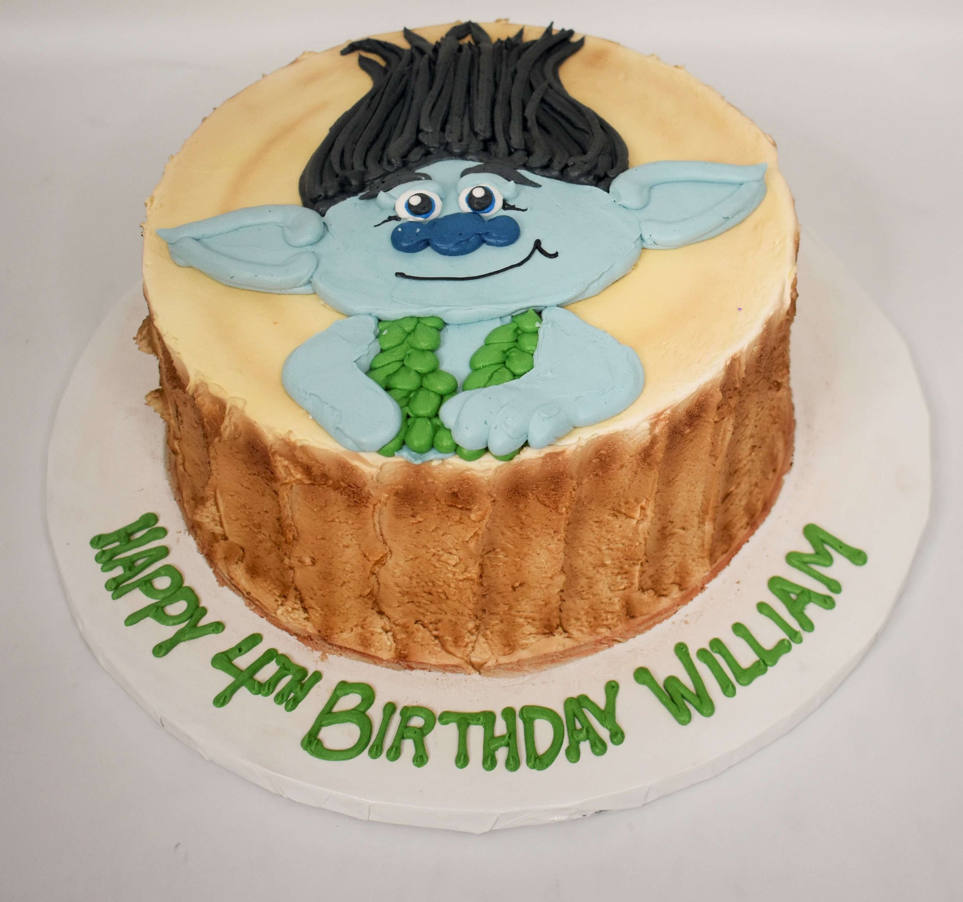 McArthur's Bakery Custom Cake with Troll Face place on a stump