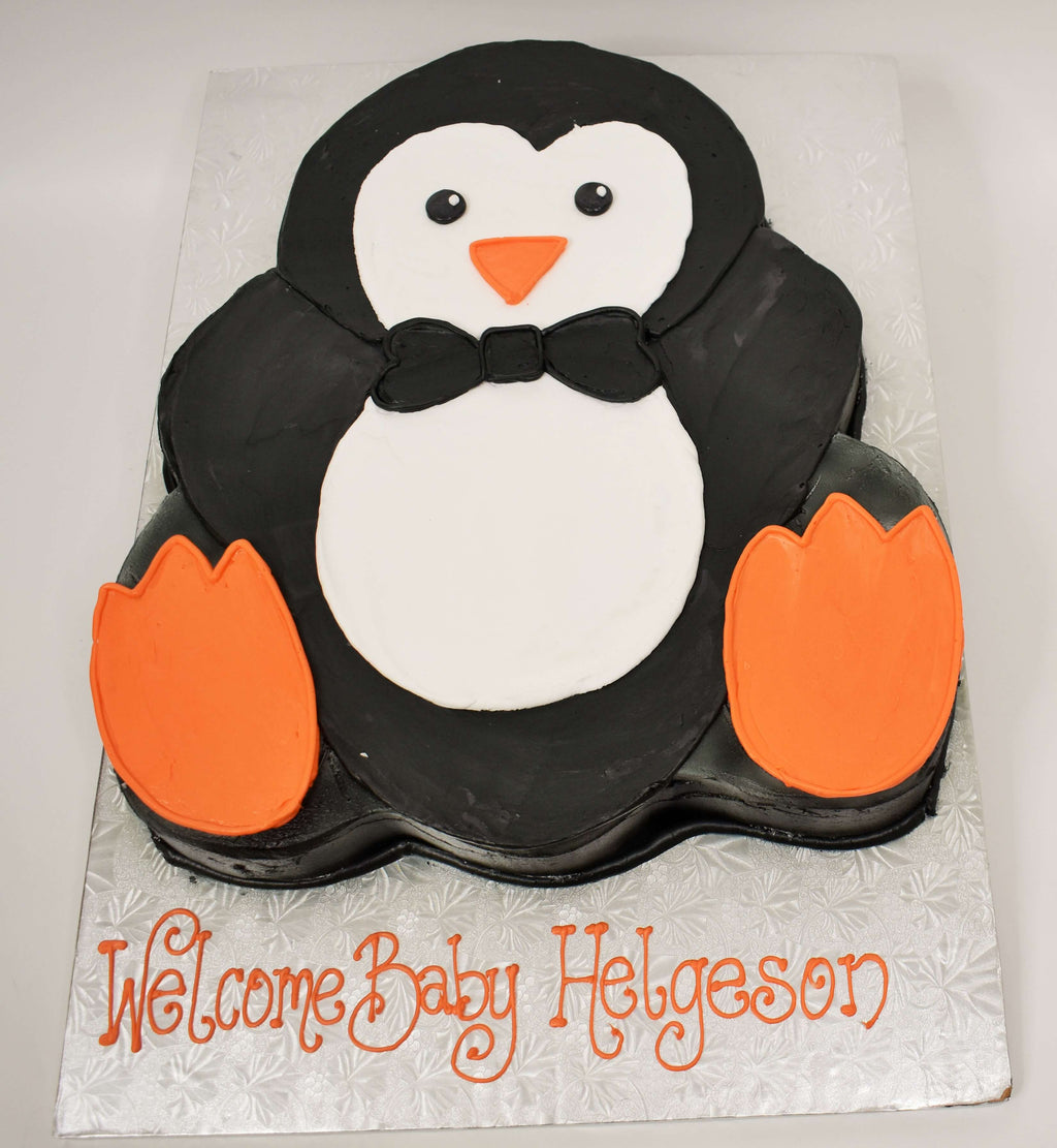 MaArthur's Bakery Custom Cake with a Penguin Cut Out Wearing a bowtie