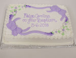 MaArthur's Bakery Custom Cake with Purple Icing Bows and white and Purple Flowers