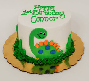 McArthur's Bakery Custom Cake with Green Dinasour and Green Grass