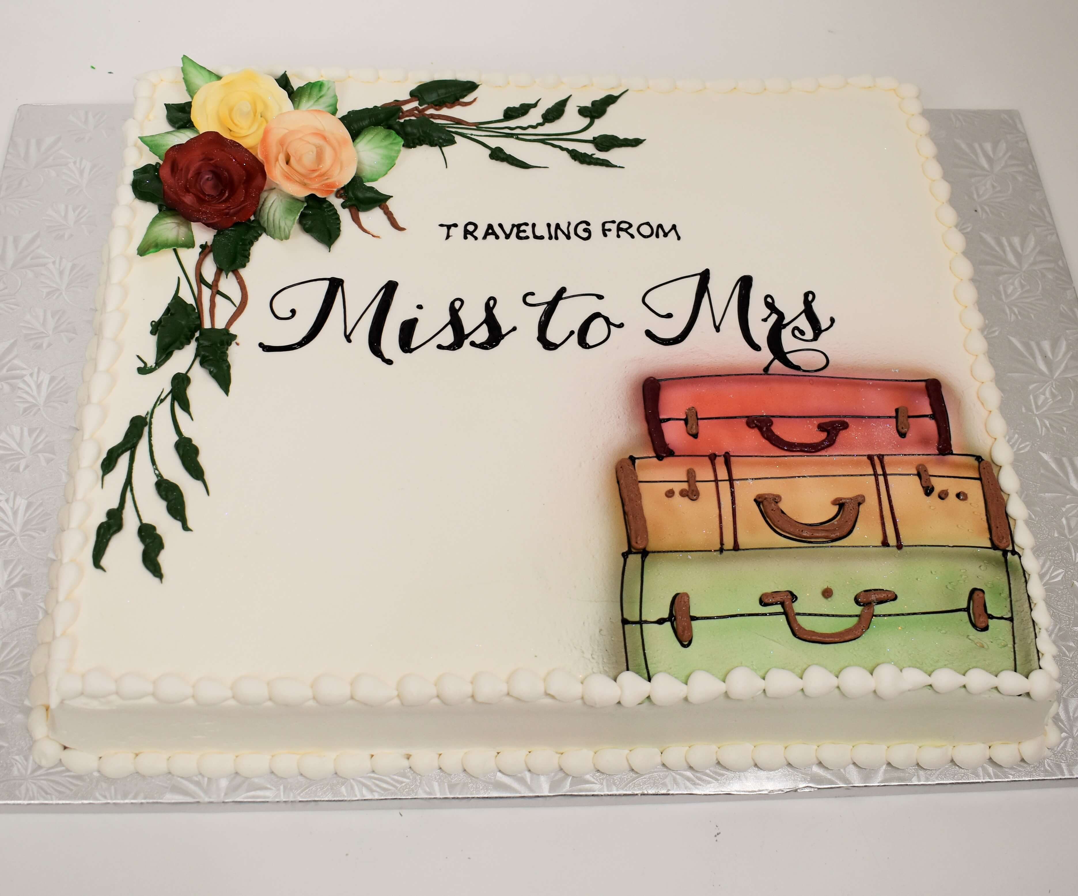 MaArthur's Bakery Custom Cake with Mr. & Mrs. with Suitcases and Roses