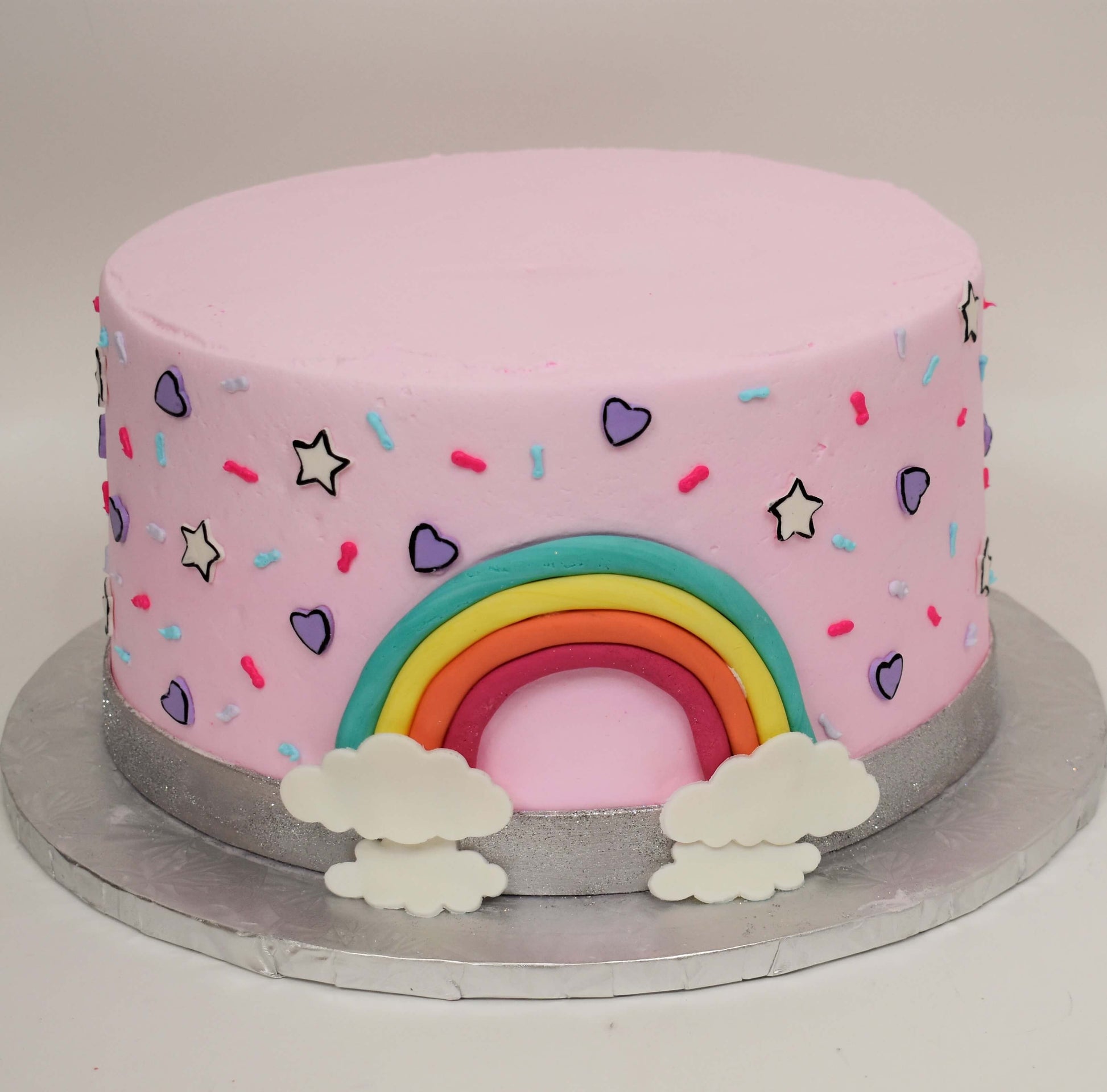 McArthur's Bakery Custom Cake with Rainbows, Hears, Stars, Sprinkles, Pink Icing