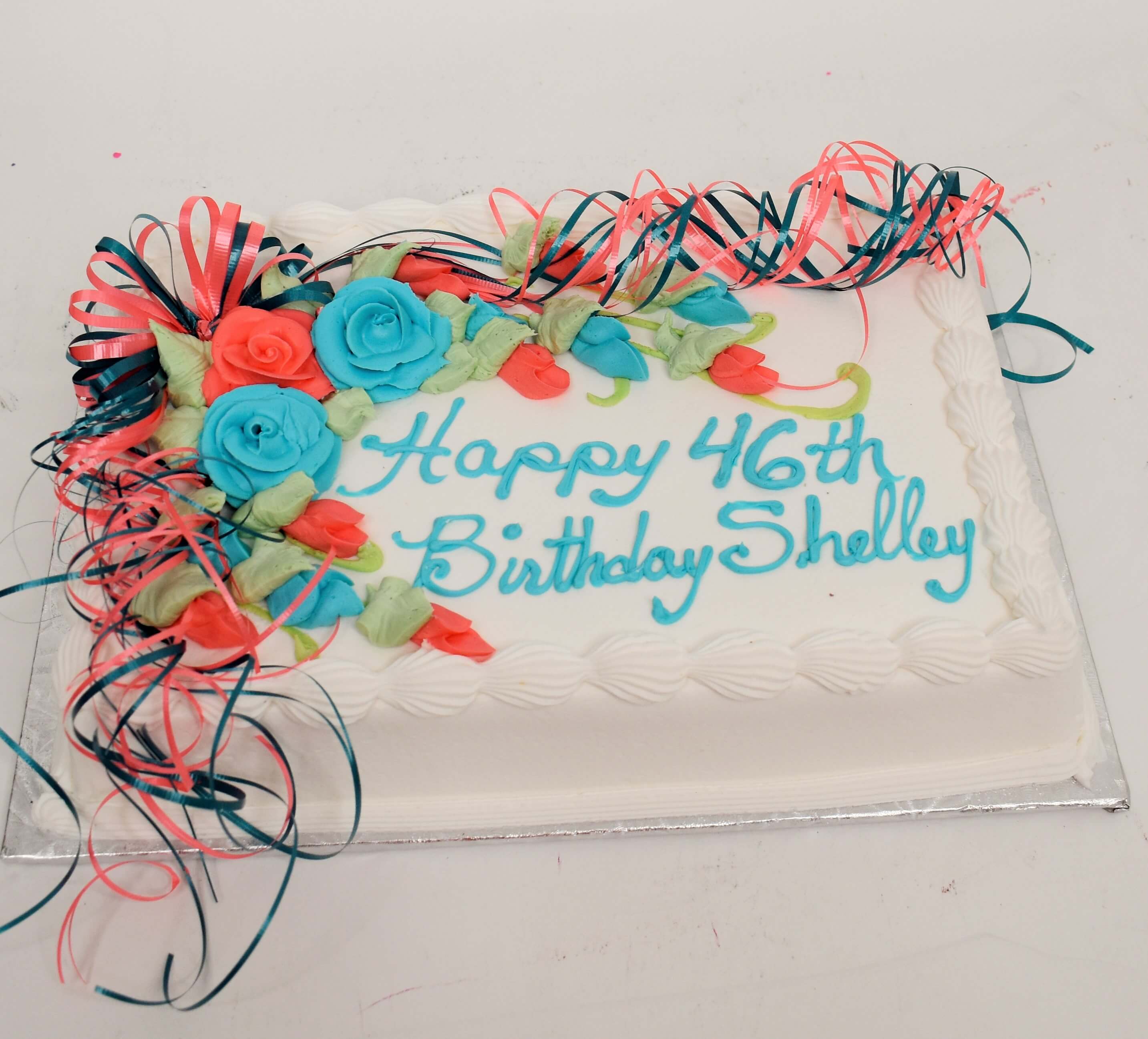 McArthur's Bakery Custom Cake With Bright Pink And Bright Blue Roses