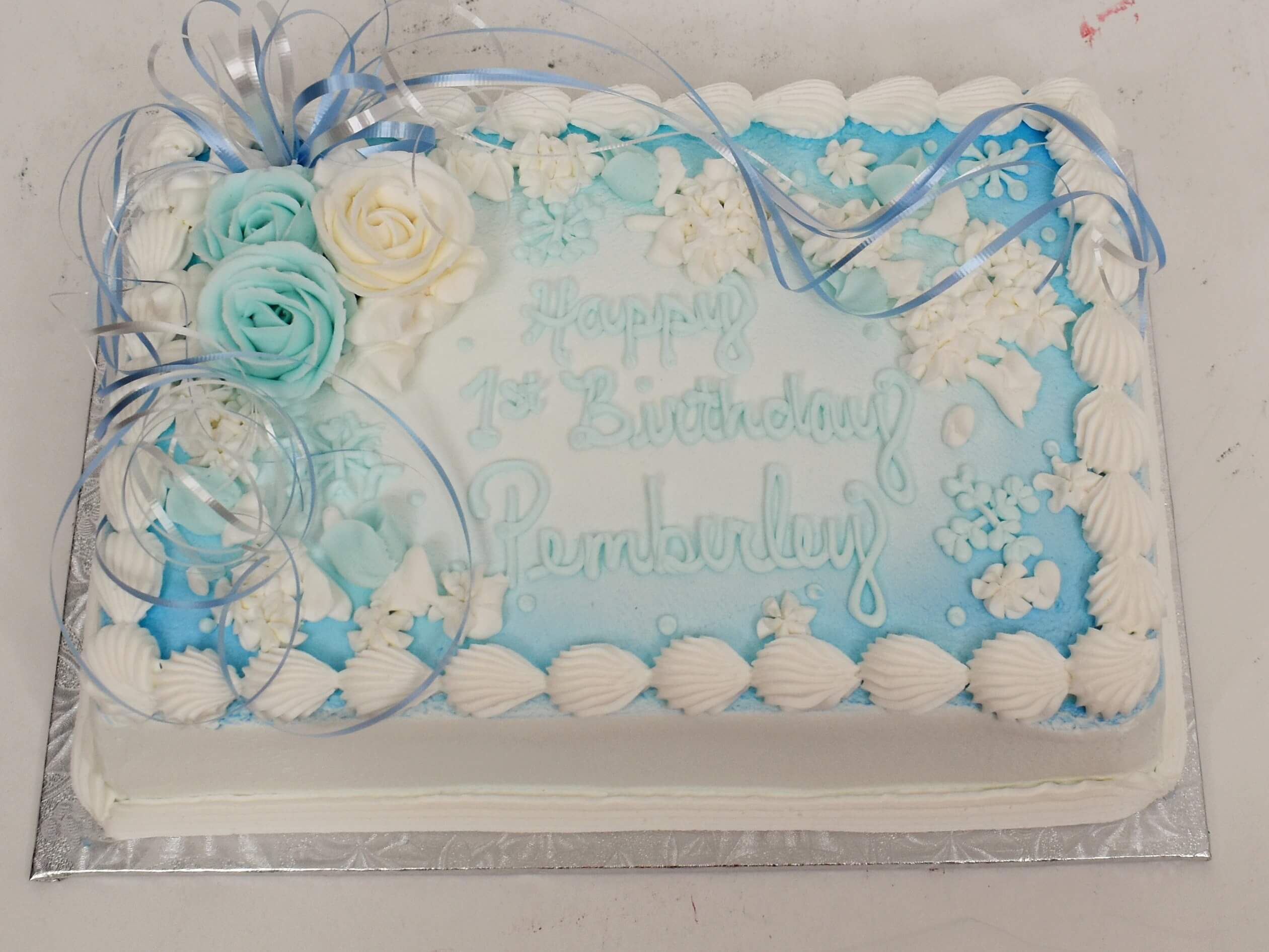 McArthur's Bakery Custom Cake With Light Blue And Pale Yellow Roses