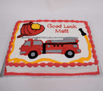 McArthur's Bakery Custom Cake With Firetruck and Fireman's Hat