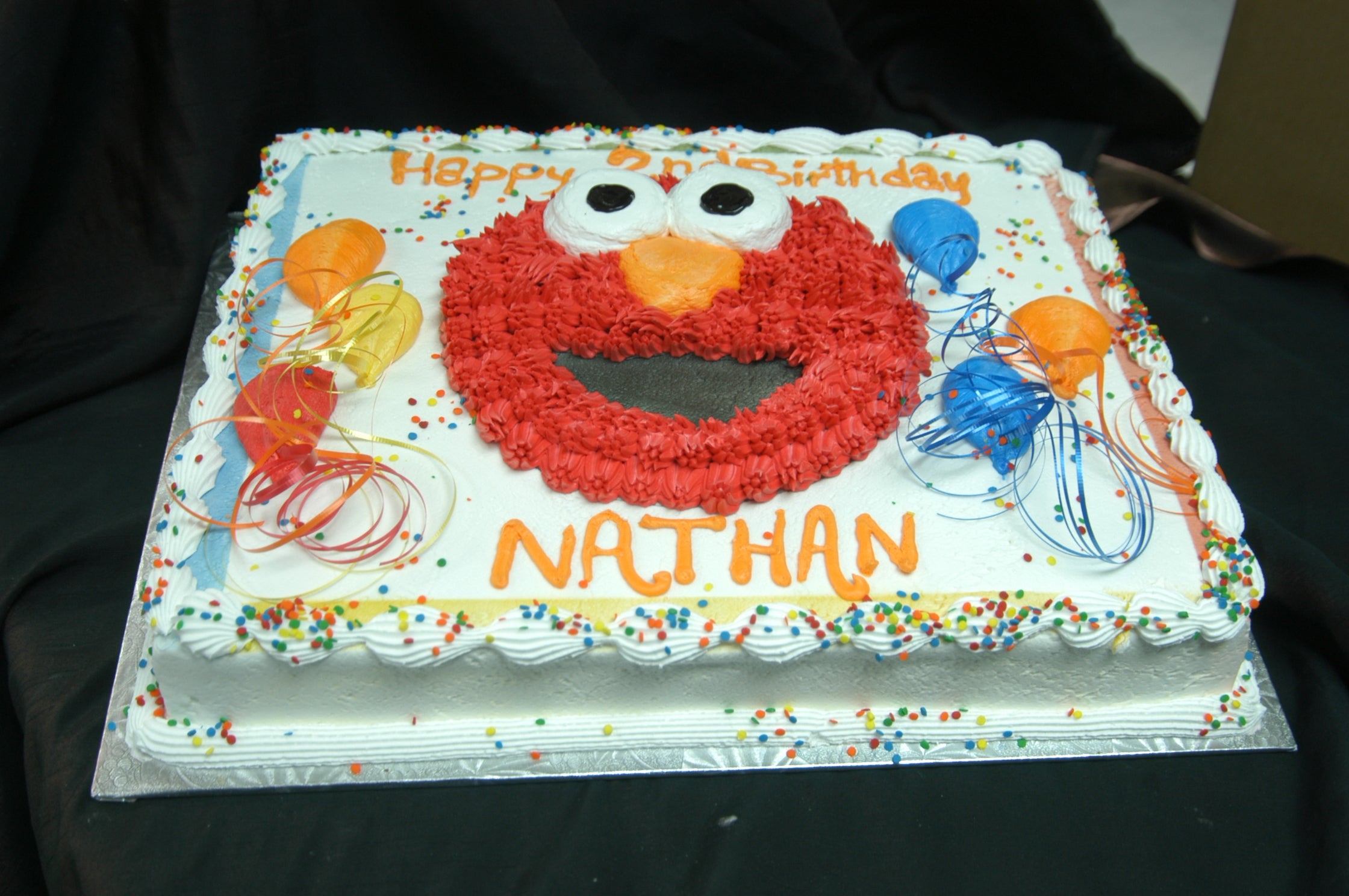 McArthur's Bakery Custom Cake with Elmo's Face and Balloons