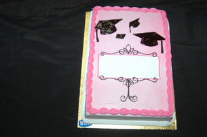 MaArthur's Bakery Custom Cake with Pink Background and Black Gradutation Caps