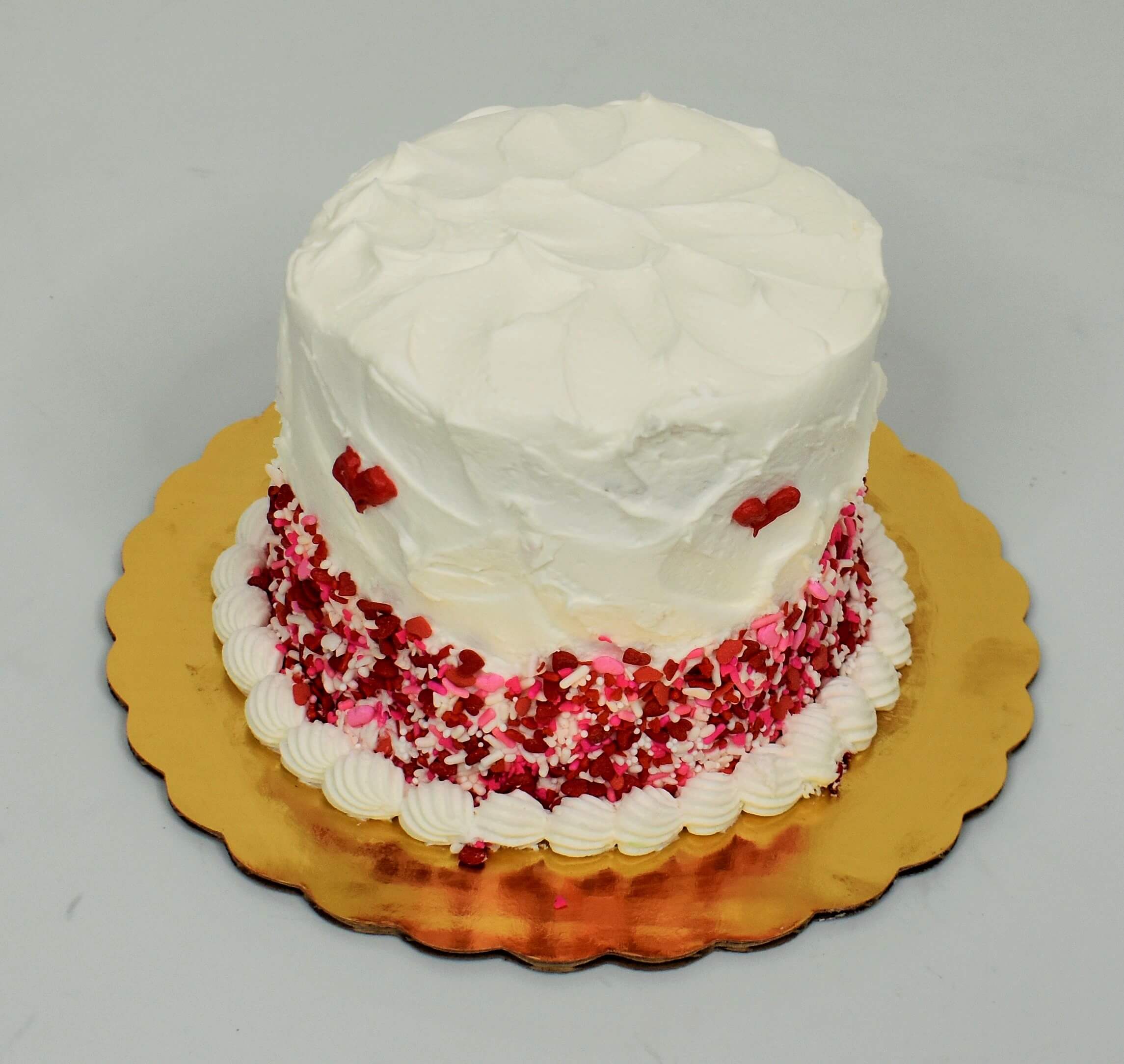White Spatula Icing With Pink Sprinkles Cake
